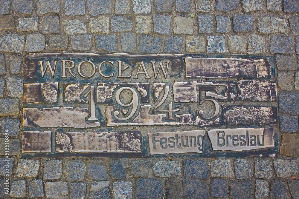 2019: Beautiful manhole bronze cover with historical date 1945 in Wroclaw 