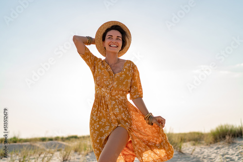 Canvas Print stylish attractive slim smiling woman on beach in summer style fashion trend out