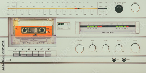 Foto Retro styled image of a vintage silver audio system with cassette player, radio