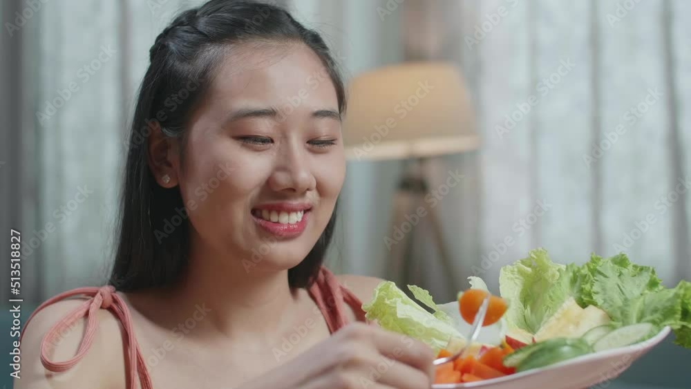 Close Up Of Asian Woman Eating Healthy Food Before Smiling And Showing Thumbs Up Gesture To Camera At Home
Close Up Of Asian Woman Eating Healthy Food Before Smiling And Showing Thumbs Up Gesture To Camera At Home