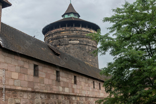 фотографія A fragment of the fortress wall and Frauentorturm (Women's Gate Tower), Nurember