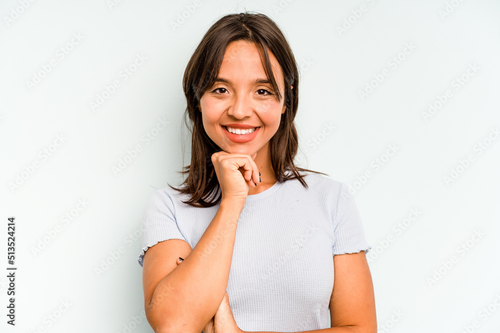Young hispanic woman isolated on blue background excited pointing with forefingers away. Young hispanic woman isolated on blue background excited pointing with forefingers away.