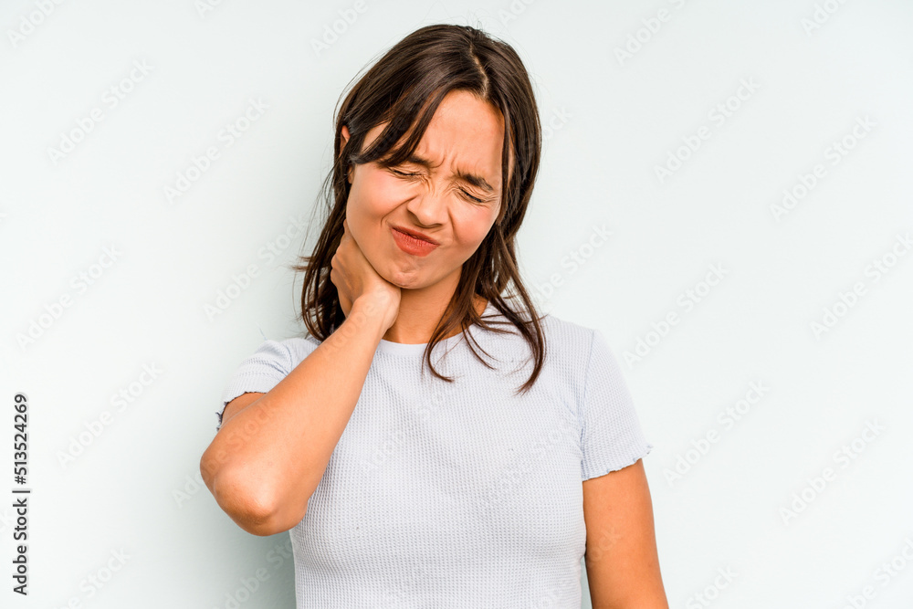 Young hispanic woman isolated on blue background crossing fingers for having luck Young hispanic woman isolated on blue background crossing fingers for having luck