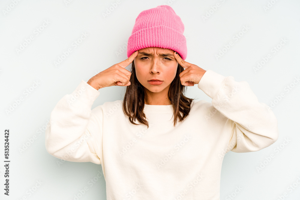 Young hispanic woman isolated on blue background laughs out loudly keeping hand on chest. Young hispanic woman isolated on blue background laughs out loudly keeping hand on chest.