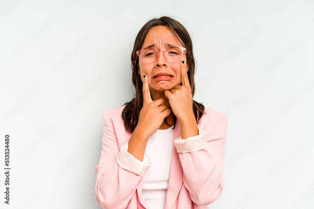 Young hispanic woman isolated on blue background pointing upside with opened mouth. Young hispanic woman isolated on blue background pointing upside with opened mouth.
