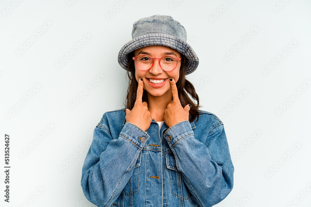 Young hispanic woman isolated on blue background screaming, very excited, passionate, satisfied with something. Young hispanic woman isolated on blue background screaming, very excited, passionate, satisfied with something.