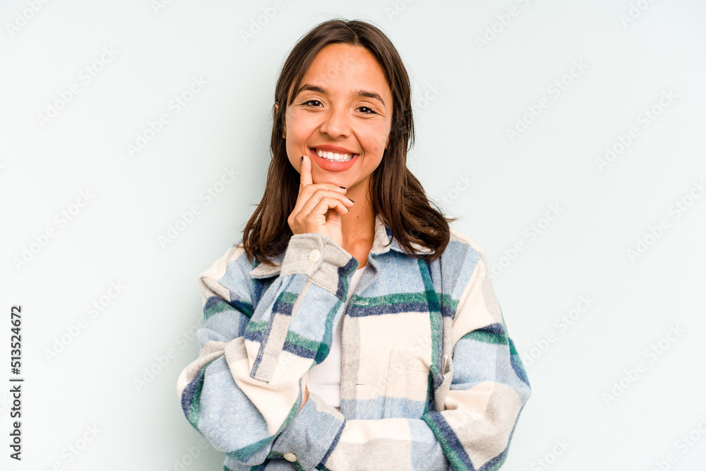 Young hispanic woman isolated on blue background biting fingernails, nervous and very anxious. Young hispanic woman isolated on blue background biting fingernails, nervous and very anxious.