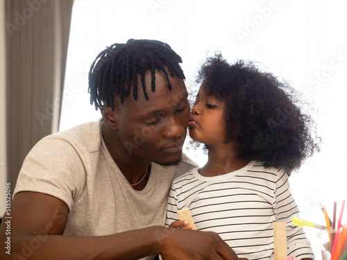 Family dad father male man African black person kiss love emohug son girl child woman female portrait young adult parent indoor living room home relationship enjoy fun together beautiful pretty happy