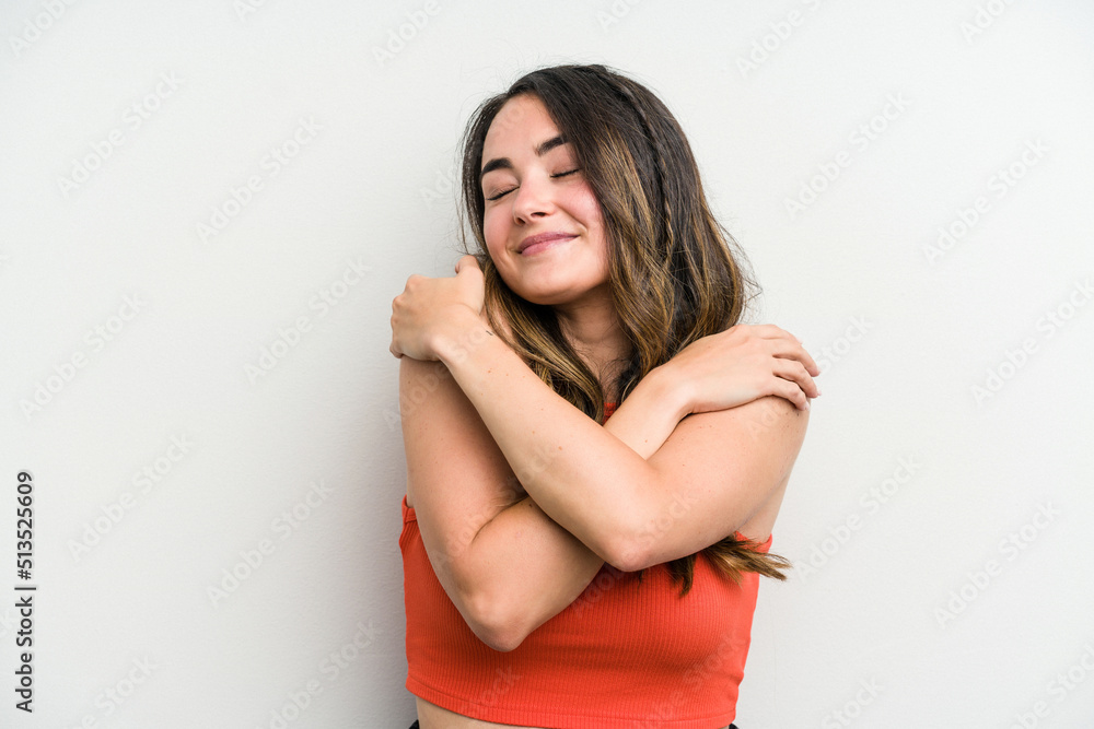 Young caucasian woman isolated on white background hugs, smiling carefree and happy. Young caucasian woman isolated on white background hugs, smiling carefree and happy.