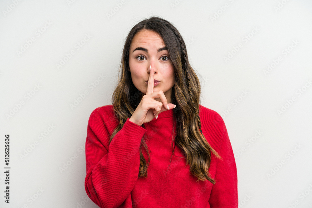 Young caucasian woman isolated on white background keeping a secret or asking for silence. Young caucasian woman isolated on white background keeping a secret or asking for silence.