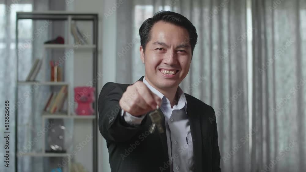 Close Up Of Asian Real Estate Agent Smiling And Showing Keys To Camera In The House For Sale
Close Up Of Asian Real Estate Agent Smiling And Showing Keys To Camera In The House For Sale