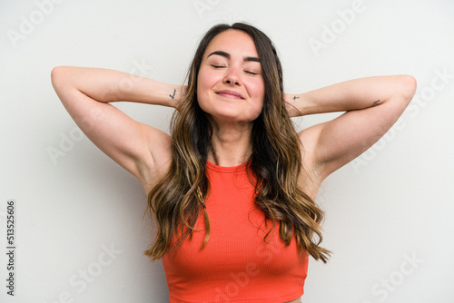 Young caucasian woman isolated on white background feeling confident, with hands behind the head.