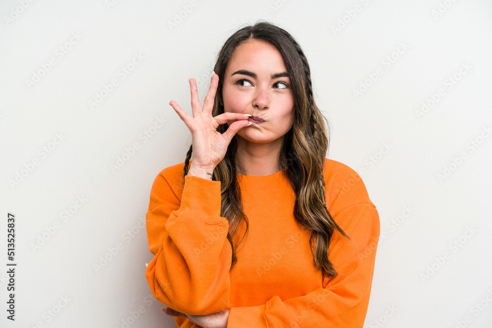 Young caucasian woman isolated on white background with fingers on lips keeping a secret. Young caucasian woman isolated on white background with fingers on lips keeping a secret.