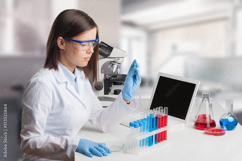 Female young Scientist Working in The Lab Female young Scientist Working in The Lab