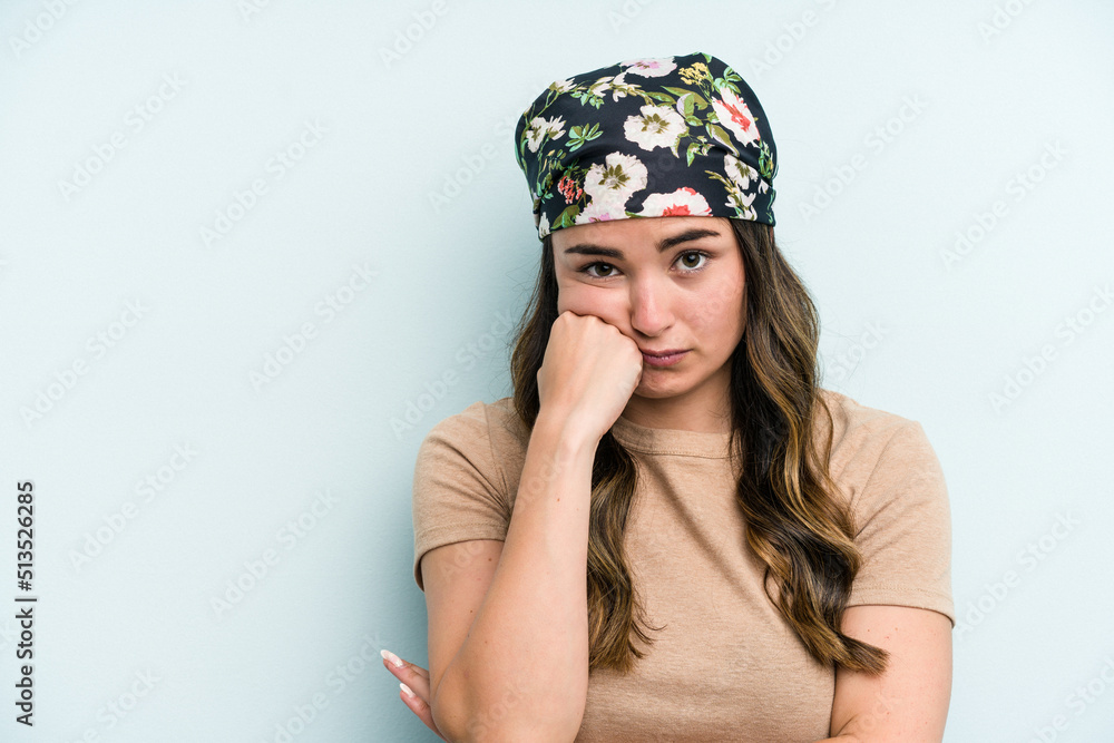 Young caucasian woman isolated on blue background who feels sad and pensive, looking at copy space. Young caucasian woman isolated on blue background who feels sad and pensive, looking at copy space.