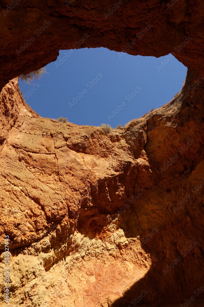 Natural cave in nature with a view of the mountains and sea view