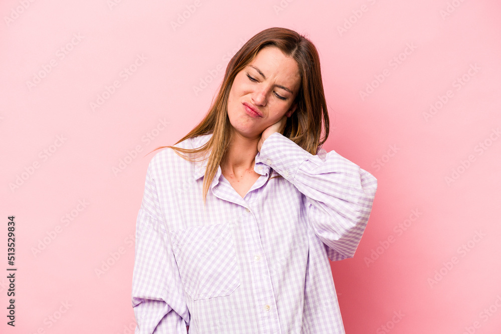 Fototapeta premium Young caucasian pregnant woman isolated on white background having a neck pain due to stress, massaging and touching it with hand.
