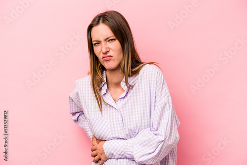 Young caucasian pregnant woman isolated on white background having a liver pain, stomach ache. © Asier