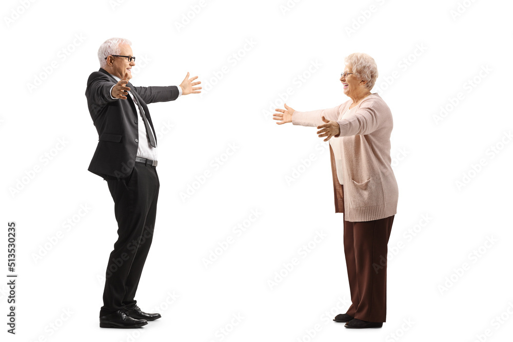 Businessman greeting an elderly woman with arms wide open Businessman greeting an elderly woman with arms wide open