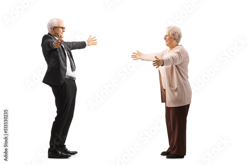 Businessman greeting an elderly woman with arms wide open