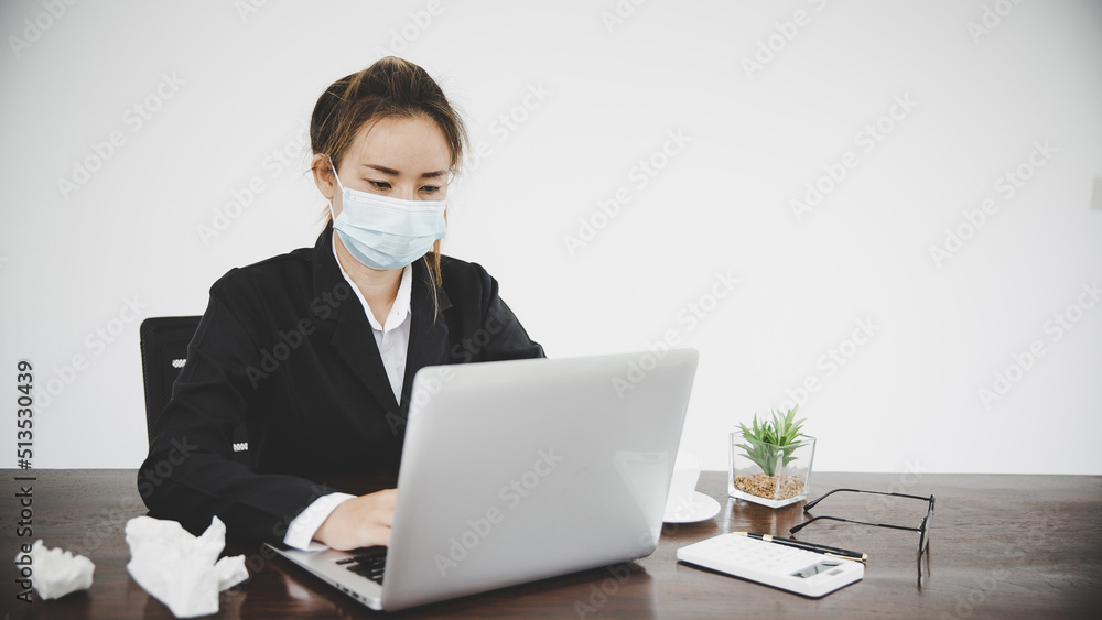 Sick young asian business woman wearing protective face mask Sick young asian business woman wearing protective face mask