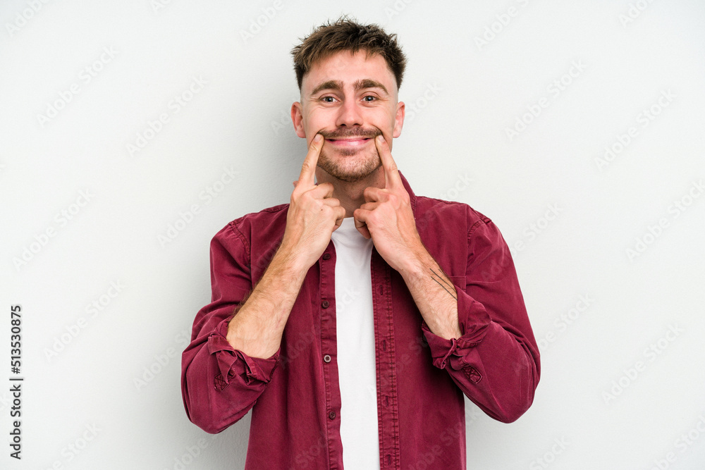 Young caucasian man isolated on white background doubting between two options. Young caucasian man isolated on white background doubting between two options.