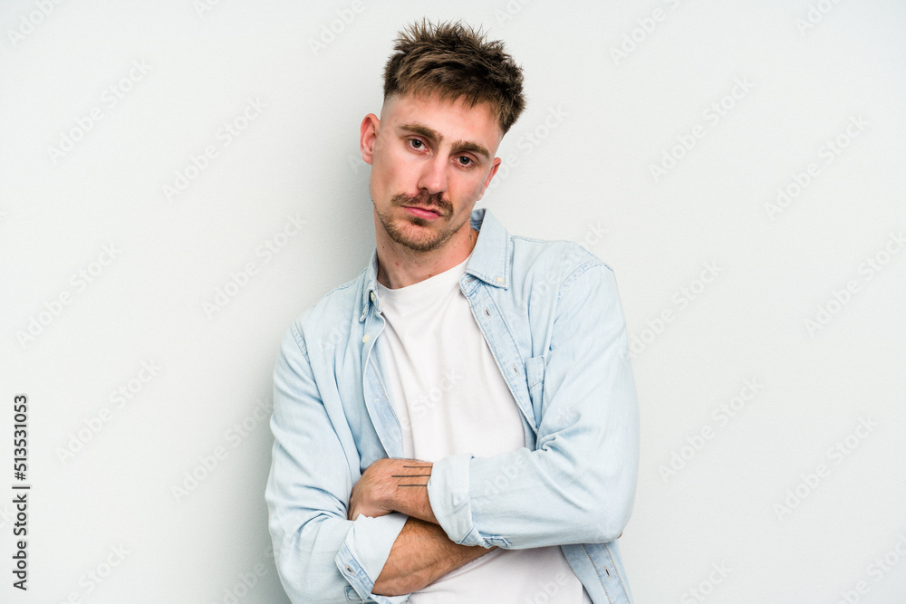 Young caucasian man isolated on white background who is bored, fatigued and need a relax day. Young caucasian man isolated on white background who is bored, fatigued and need a relax day.
