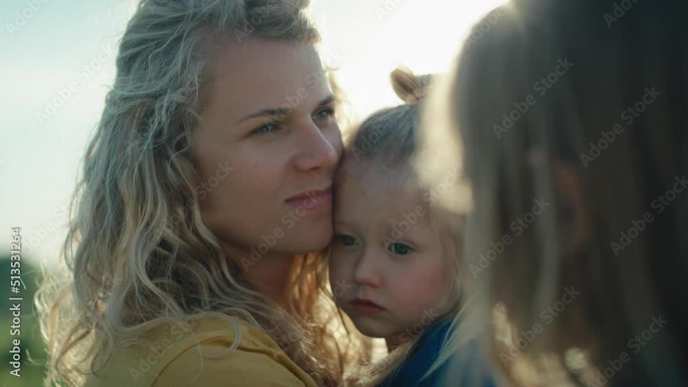 Close up of mom with two daughters spending time at the meadow. Shot with RED helium camera in 4K. Close up of mom with two daughters spending time at the meadow. Shot with RED helium camera in 4K.