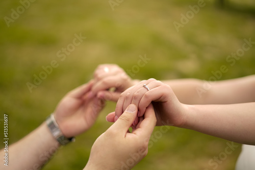 bride and groom hold hands. Large frame. You can see the wedding rings © Дмитрий Дементьев