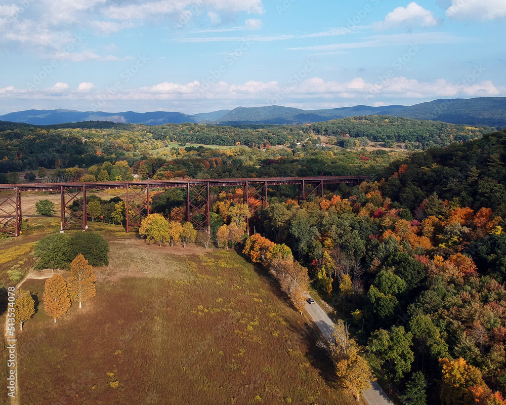 aerial view of a railroad bridge in autumn