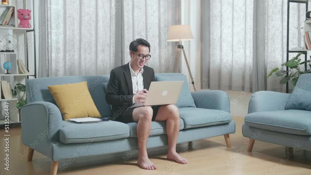 Full View Of Asian Businessman In Jacket And Shorts Showing Thumbs Up Gesture While Having Video Call On A Laptop At Home
Full View Of Asian Businessman In Jacket And Shorts Showing Thumbs Up Gesture While Having Video Call On A Laptop At Home