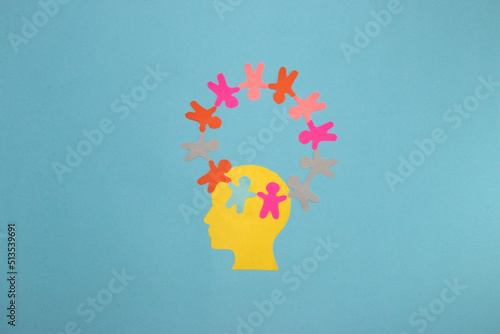 yellow paper head on it circle of paper people, creative modern design on pastel blue background, population day, the importance of all people in this world