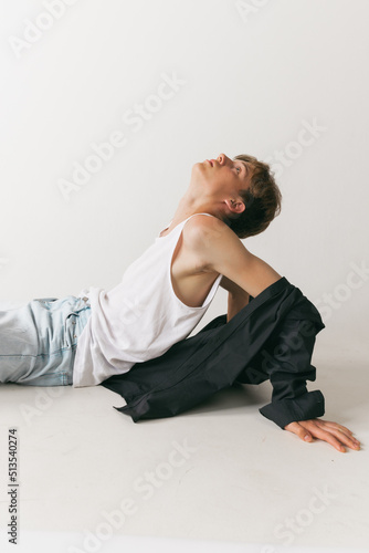 Portrait of young man, teen, student posing isolated over white studio background. Concept of fashion, youth, emotions, facial expression, ad © master1305