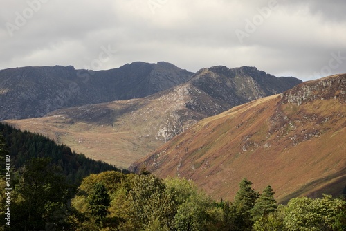 Beautiful scene of Goatfell mountains, Island of Arran, Scotland, UK and a gray cloudy sky photo