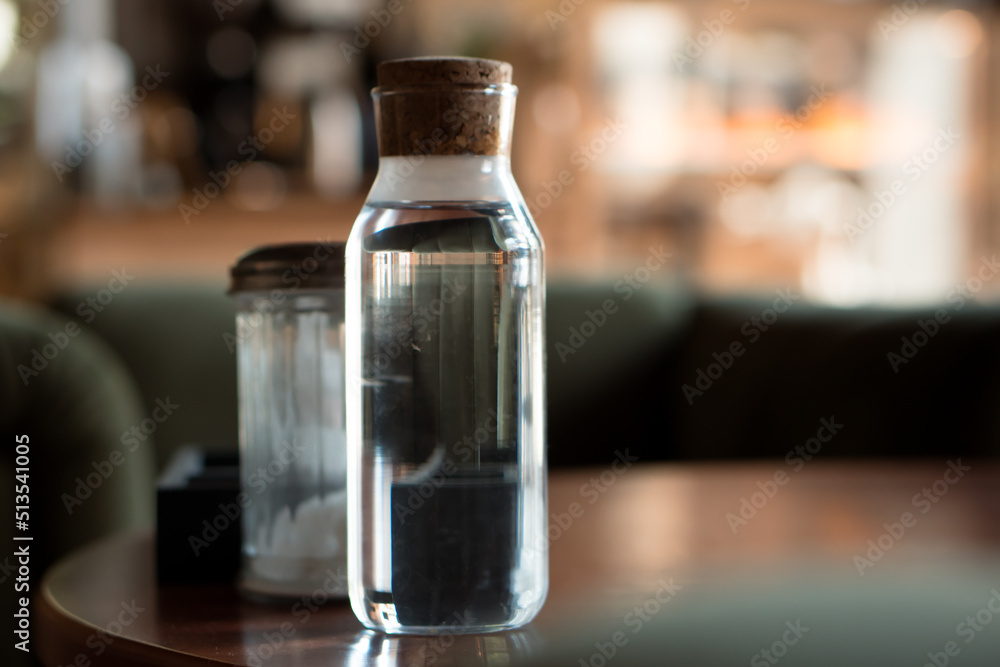 bottle of still water on table in cafe bottle of still water on table in cafe