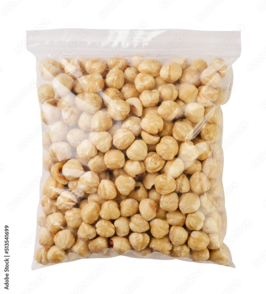 Hazelnuts peeled in a package on a white background. Isolated Hazelnuts peeled in a package on a white background. Isolated