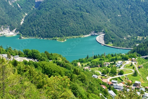 View of Lago di Cadore lake and Pieve di Cadore dam and the village of Sottocastello in Veneto region and Belluno province in Italy