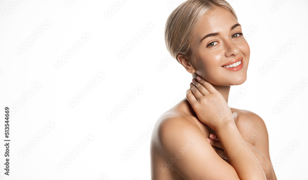 Obraz premium Skin care and women. Blond smiling girl after washing, with glowing body and face, white smile, posing against studio background