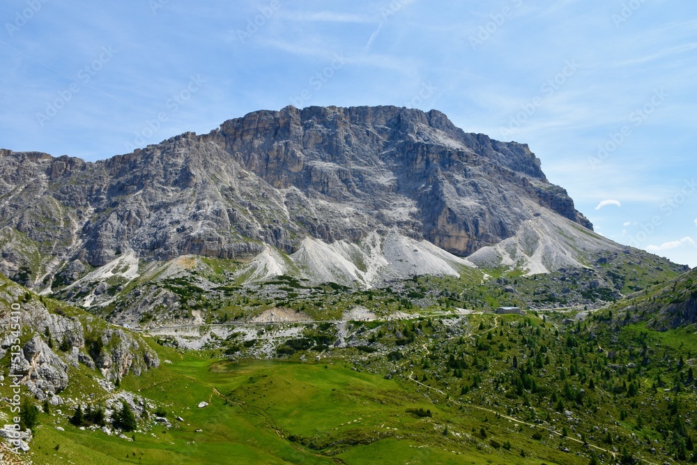 Fototapeta premium View of Monte Lagazuoi in Dolomite mountains and road at Valparola pass and Valparola lake in Veneto region, Italy