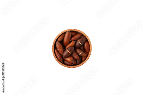 Baru nuts in wooden bowl on white background, top view. Baru seeds are high in fat, proteins, dietary fibers, magnesium, iron and zinc photo