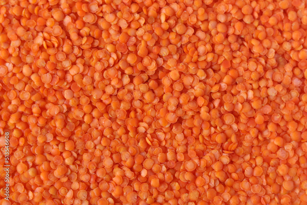 Red lentils pattern as background. Natural organic lentils. Top view. Copy space.