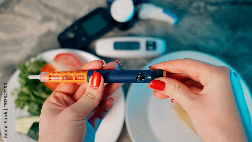 Diabetic devices - glucometer, lancet and insulin. Piece of cake and fresh vegetables. Dilemma of choosing between healthy food and delicious sweets. High sugar. Adherence to diet and healthy eating