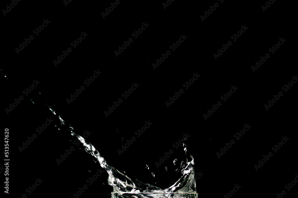 Water splashing on a black background. abstract background of water diffused on black background