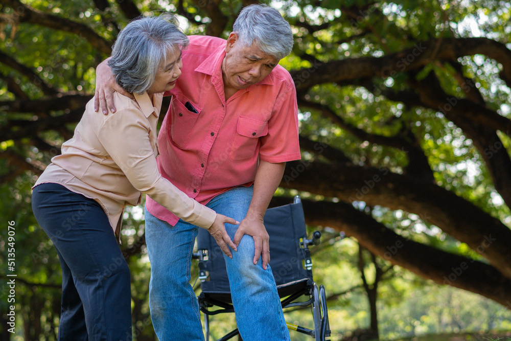 Asian senior man falling down on lying floor at park after Stumbled and Crying in pain and him wife came to help support. Concept of old elderly insurance and health care Asian senior man falling down on lying floor at park after Stumbled and Crying in pain and him wife came to help support. Concept of old elderly insurance and health care