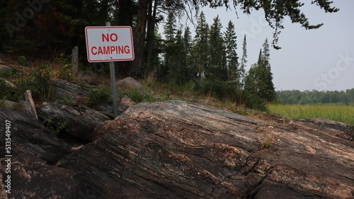 No camping sign on the shore of Caddy Lake, Manitoba, Whiteshell Provincial Park photo