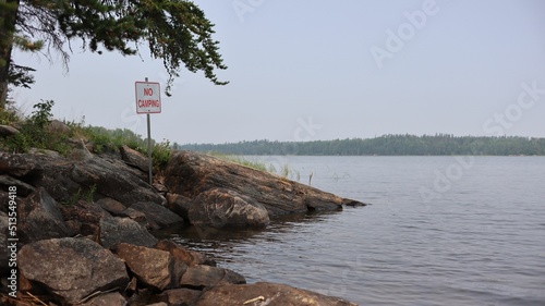No camping sign on the shore of Caddy Lake, Manitoba, Whiteshell Provincial Park photo