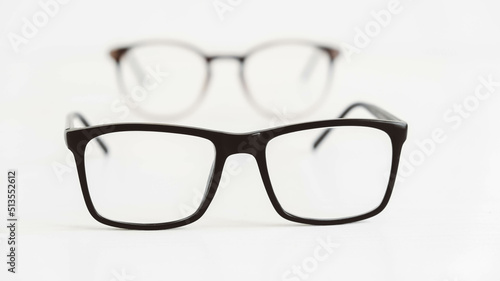 Optical glasses of different shapes on a white background
