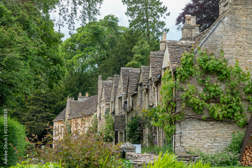 Fototapeta premium honey coloured Cotswold stone houses in Castle Combe Wiltshire England often named as the prettiest village in England