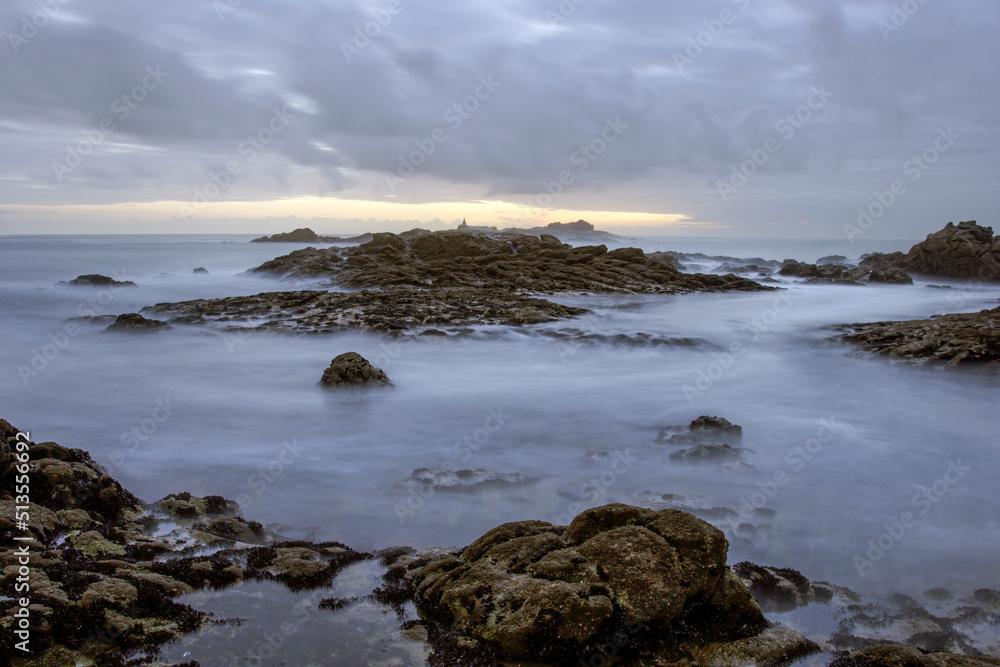 Rocky beach at sunset or dusk