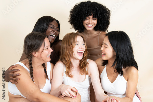 group of young girls of different sizes and races. Smiling together. Beautiful bodies. Natural beauty. Self-love.